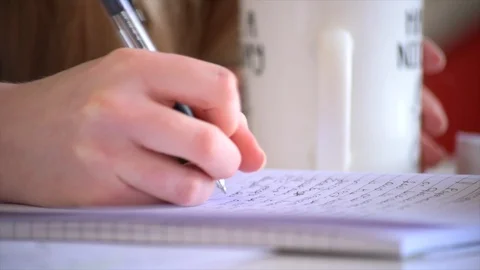 A Low Close Up Shot of a Student Making Notes Stock Footage 90208869