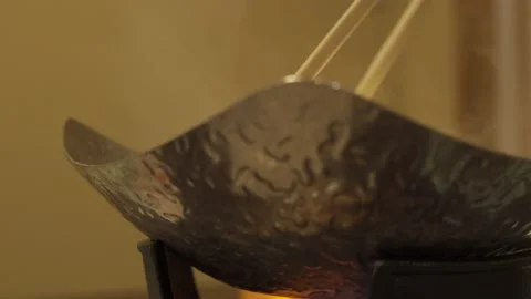 Low closeup of person adding vegetables to Japanese shabushabu hotpot Stock Footage 157666482