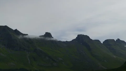 Low Cloud Band Crossing Dark Nordic Mountain Ridge Stock Footage 340140061