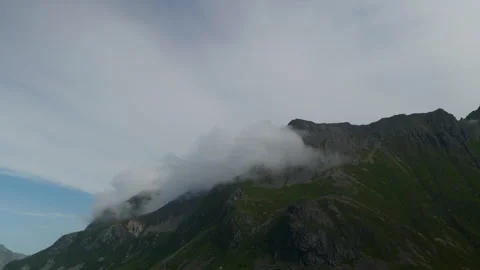 Low Cloud Bank Sliding Across Rugged Nordic Mountain Ridge Stock Footage 340139505