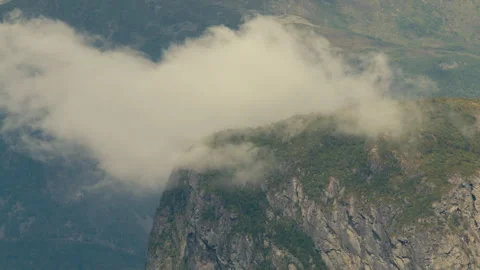 Low Cloud Bank Sliding Across Steep Norwegian Cliff Face Stock Footage 340323728