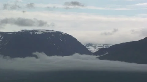 Low cloud hanging in the glacial valley Stock Footage 37320545
