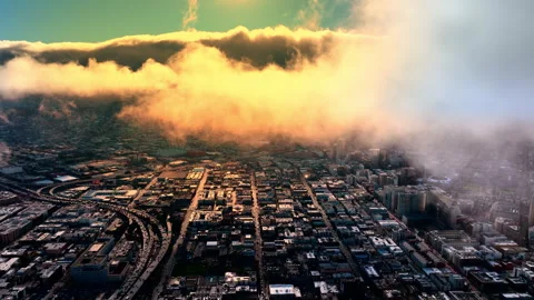 Low cloud layer rolling over urban grid at dusk, San Francisco Stock Footage 337463098