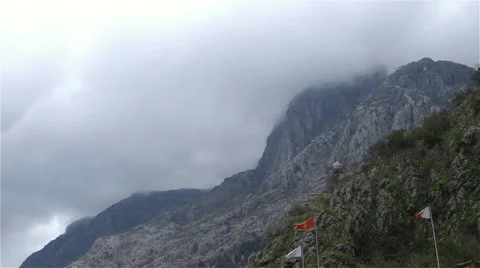 LOW CLOUD OVER MOUNTAIN TOP KOTOR MONTENEGRO Stock Footage 64554646