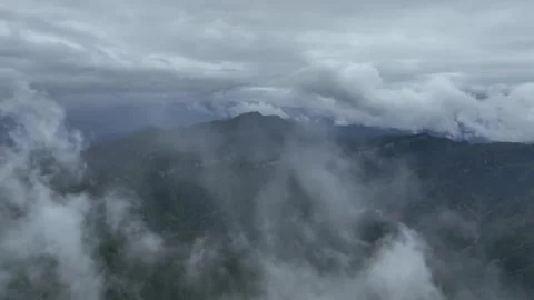 Low Clouds Above Green Mountain Range in Niubeishan, China Stock Footage 344034438