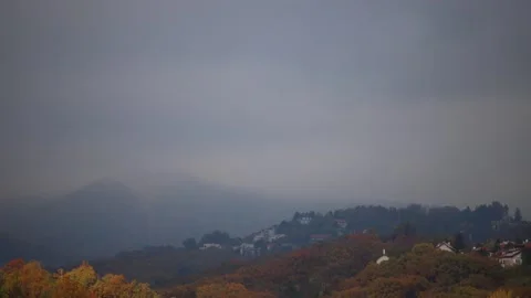 Low clouds above the inhabited hill Stock Footage 142136953