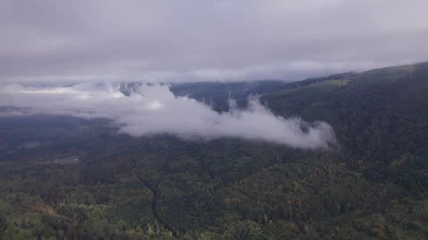 Low clouds against a mountain Stock Footage 253831869