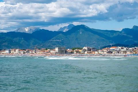 Low clouds and high mountains over beach town of Viareggio in Italy. Stock Photos