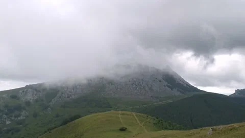 Low clouds around the mountainous massif of Amboto Stock Footage 132834853