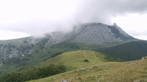 Low clouds around the mountainous massif of Amboto Stock Footage 132834913