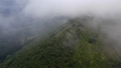 Low clouds around the mountainous massif of Amboto in Urkiola Basque Country Stock Footage 145650688