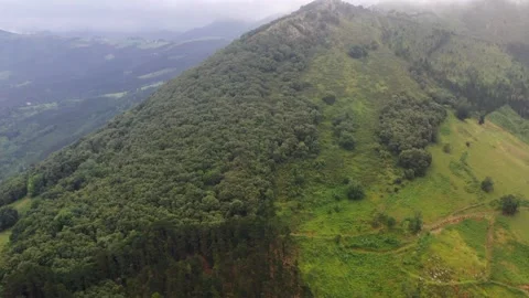 Low clouds around the mountainous massif of Amboto in Urkiola Basque Country Stock Footage 145650715