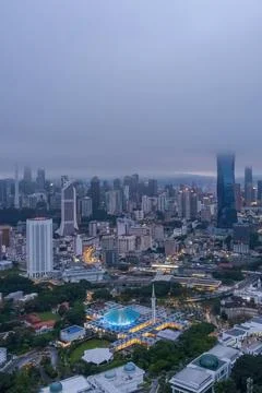 Low clouds drape over the city Stock Photos
