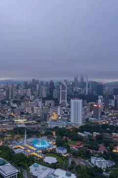 Low clouds drape over the city Stock Photos