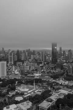 Low clouds drape over the city Stock Photos