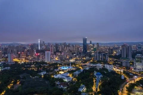 Low clouds drape over the city Stock Photos