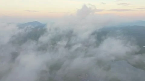 Low clouds drift above Phang Nga Bay at golden sunrise, Thailand Stock Footage 310165010
