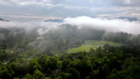 Low Clouds Drifting over Adirondack Forest near Lake Placid, Aerial Drone Stock Footage 342899777