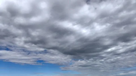 Low clouds float, releasing clear blue sky. daylight cloudy landscape. timelapse Video stock 302729619