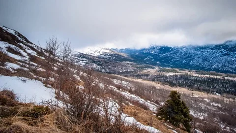 Low clouds flow into Arctic Valley in the Chugach State Park In Alaska Stock Footage 70859632
