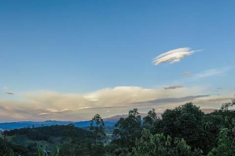 Low clouds formation on a mostly clear sky Stock-Fotos