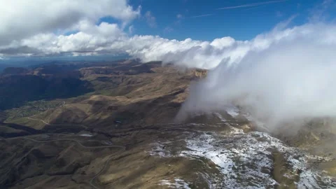 Low clouds in the mountains. Aerial view of low fog in mountainous area Stock Footage 241012138