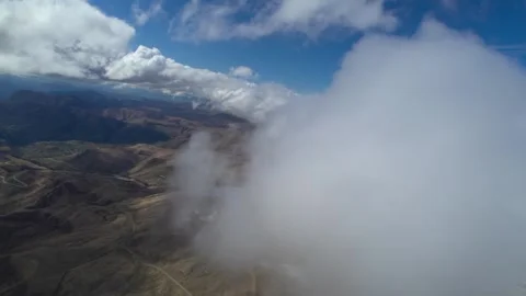 Low clouds in the mountains. Aerial view of low fog in mountainous area Stock Footage 241012278