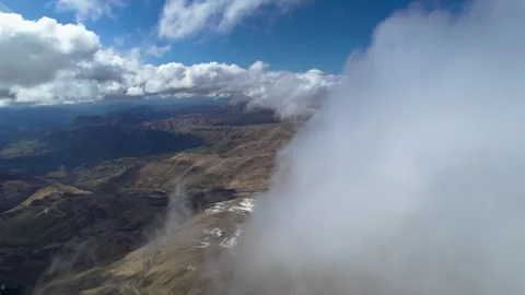 Low clouds in the mountains. Aerial view of low fog in mountainous area Stock Footage 241012310