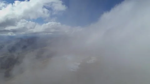 Low clouds in the mountains. Aerial view of low fog in mountainous area Stock Footage 241012490