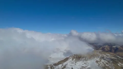 Low clouds in the mountains. Aerial view of low fog in mountainous area Stock Footage 241031637