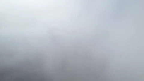 Low clouds in the mountains. Aerial view of low fog in mountainous area Stock Footage 241032385