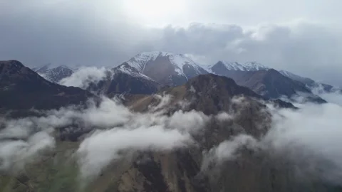 Low clouds in the mountains. Aerial view of low fog in mountainous area Stock Footage 241040657