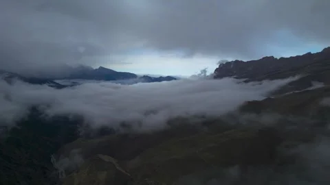 Low clouds in the mountains. Aerial view of low fog in mountainous area Stock Footage 241071825