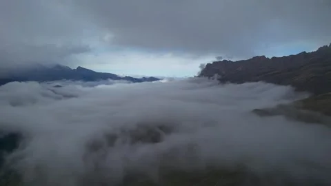 Low clouds in the mountains. Aerial view of low fog in mountainous area Stock Footage 241071826