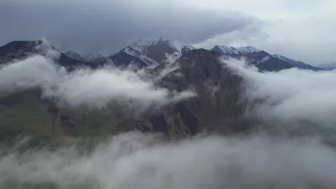 Low clouds in the mountains. Aerial view of low fog in mountainous area Stock Footage 241071890