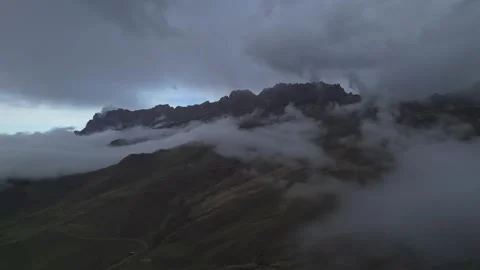 Low clouds in the mountains. Aerial view of low fog in mountainous area Stock Footage 241073118