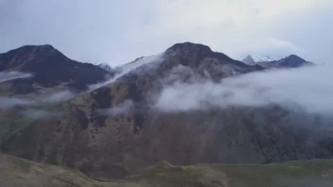 Low clouds in the mountains. Aerial view of low fog in mountainous area Stock Footage 241073242