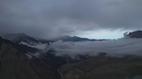 Low clouds in the mountains. Aerial view of low fog in mountainous area Stock Footage 241073435
