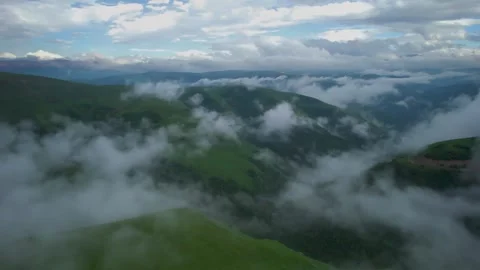 Low clouds in the mountains. Aerial view of low fog in mountainous area Stock Footage 241185219