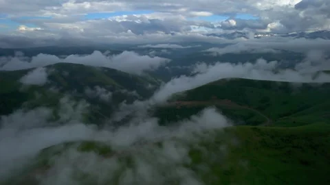 Low clouds in the mountains. Aerial view of low fog in mountainous area Stock Footage 241185438