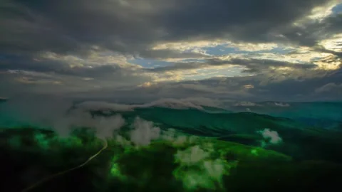 Low clouds in the mountains. Aerial view of low fog in mountainous area Stock Footage 241186113