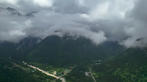 Low clouds in the mountains. Aerial view of low fog in mountainous area Stock Footage 250670510