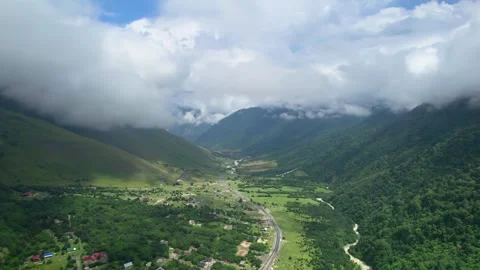 Low clouds in the mountains. Aerial view of low fog in mountainous area Stock Footage 250670874