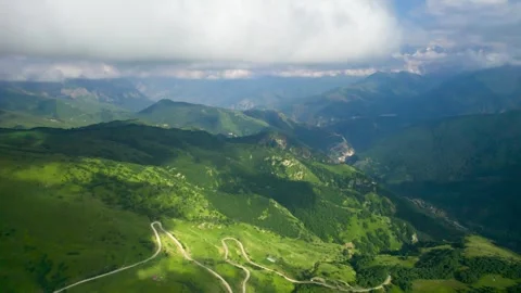 Low clouds in the mountains. Aerial view of low fog in mountainous area Stock Footage 250677692