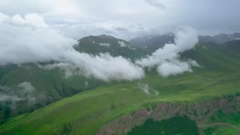 Low clouds in the mountains. Aerial view of low fog in mountainous area Video stock 250962903