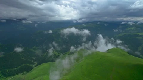 Low clouds in the mountains. Aerial view of low fog in mountainous area Video stock 250964755