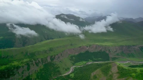 Low clouds in the mountains. Aerial view of low fog in mountainous area Video stock 250965080