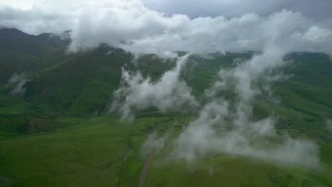 Low clouds in the mountains. Aerial view of low fog in mountainous area Video stock 250965287