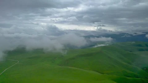 Low clouds in the mountains. Aerial view of low fog in mountainous area Video stock 250980527