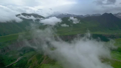 Low clouds in the mountains. Aerial view of low fog in mountainous area Video stock 250996195